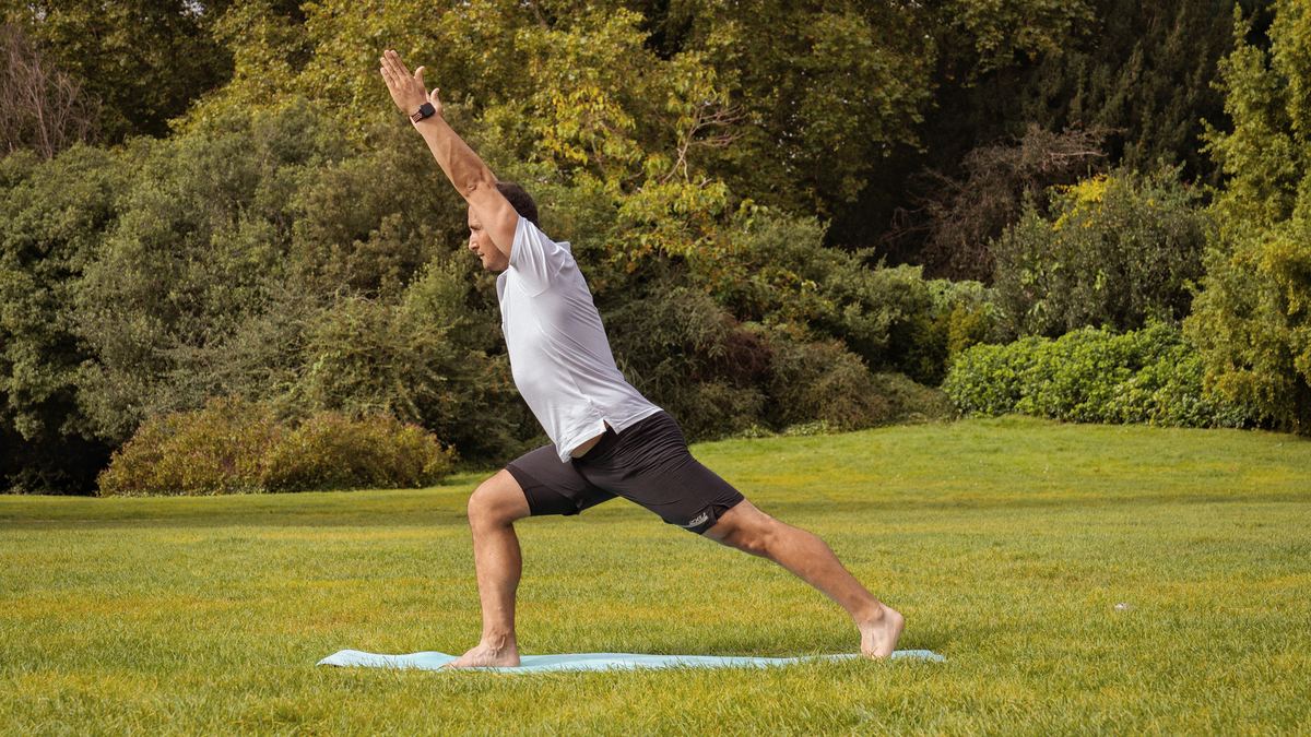Roland in a lunge on a mat in the park